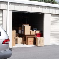 Self Storage unit with some furniture and boxes